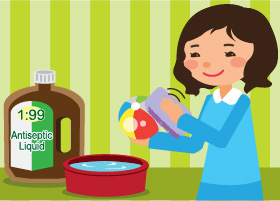 Mother is cleaning baby toys with disinfectant